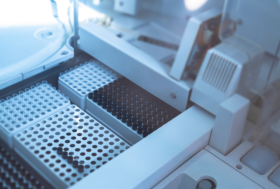 Empty test tubes inside automatic biochemical analyzer.