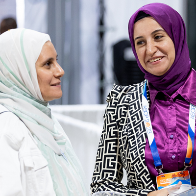 Two women at ASCP Annual Meeting 2023 talking and smiling