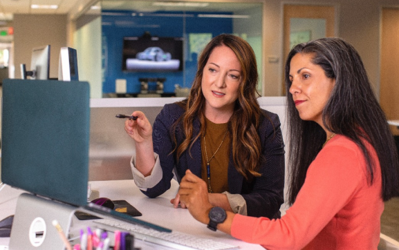 stock-photo-two-businesswomen-working-on-computer-in-office-547753810