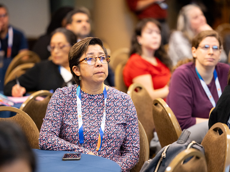 Group of ASCP annual meeting attendees listening to speaker